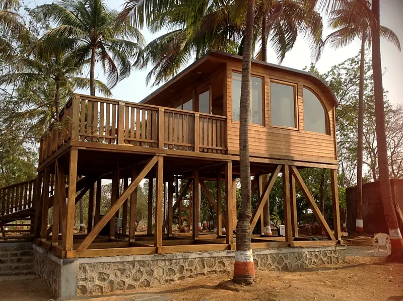 Holiday home on stilts among palms